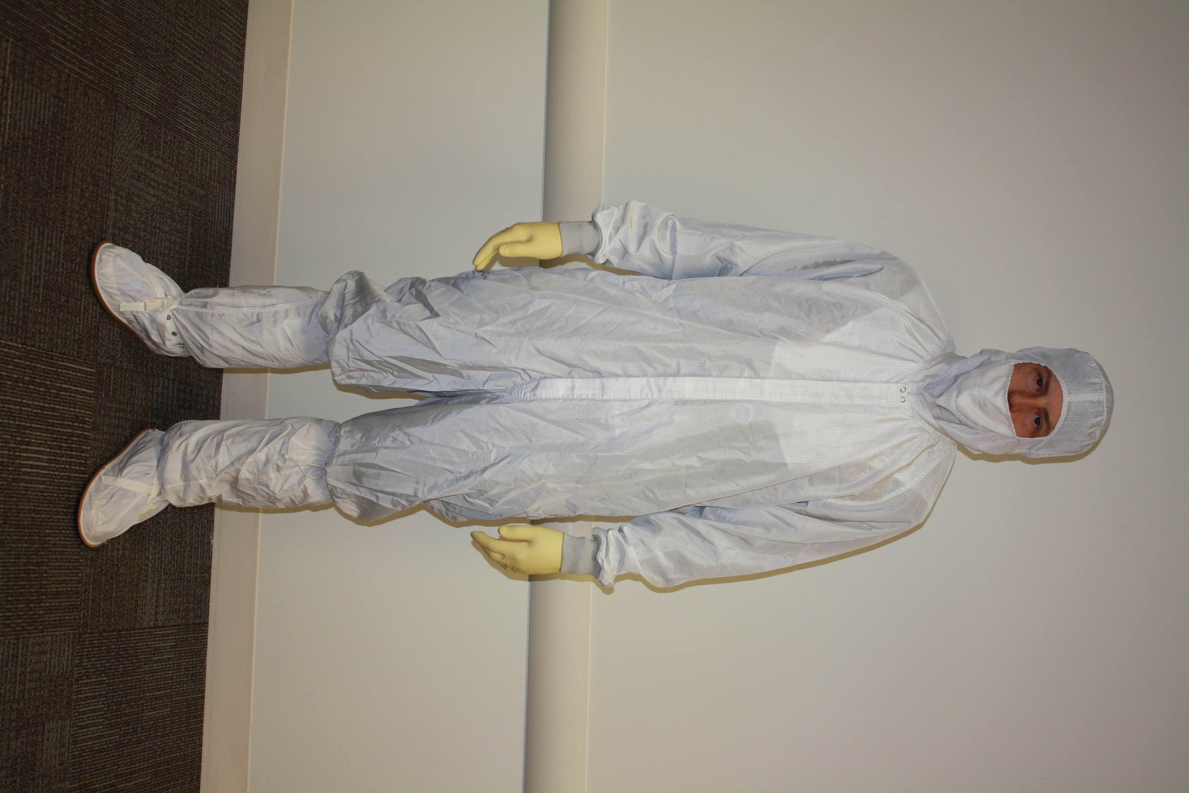 Jon wearing a white cleanroom bunny suit during his time at Intel